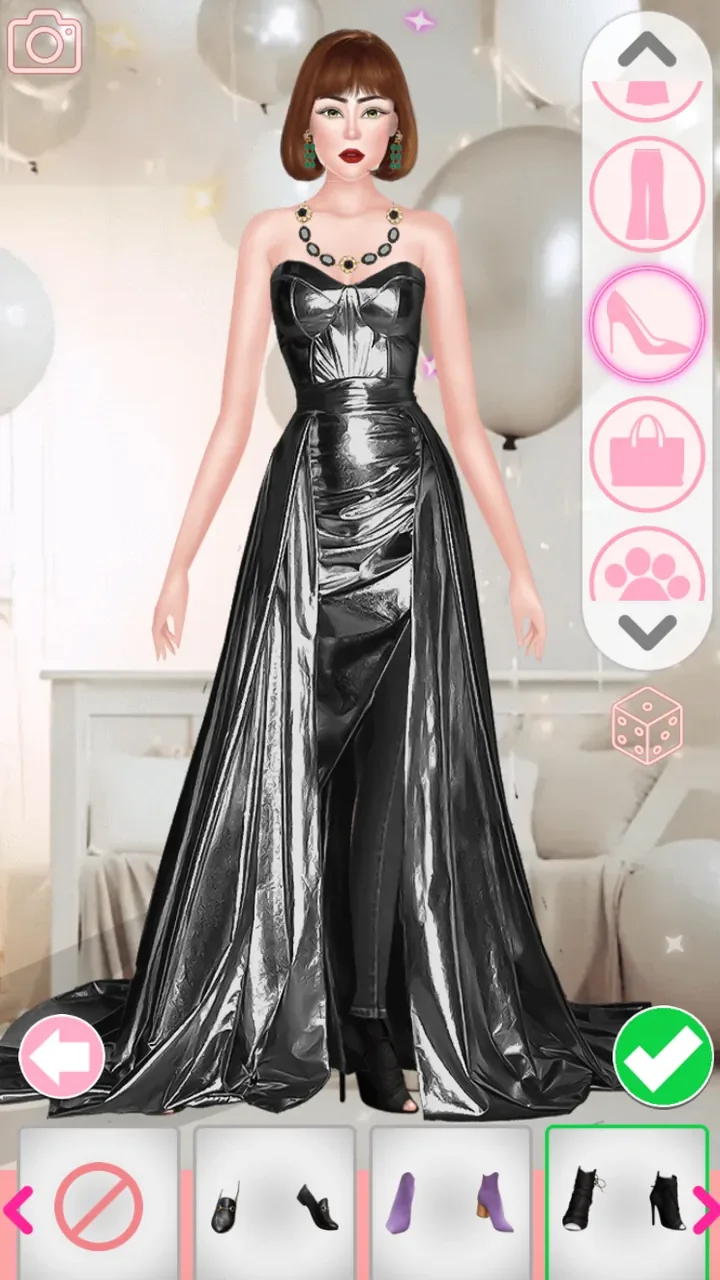 Completed reflective black gown with black heeled ankle boots